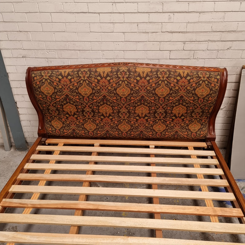 Vintage Empire style hard to find king Size bed with impressive tapestry upholstery. It comes with custom made bed slats ready to simple place your standard king size mattress on top. It is in good original detailed condition. The tapestry upholstery is in good condition and is upholstered on the back as well.