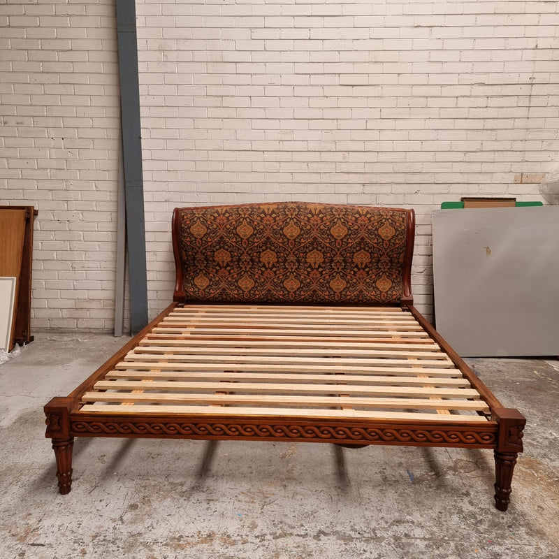 Vintage Empire style hard to find king Size bed with impressive tapestry upholstery. It comes with custom made bed slats ready to simple place your standard king size mattress on top. It is in good original detailed condition. The tapestry upholstery is in good condition and is upholstered on the back as well.