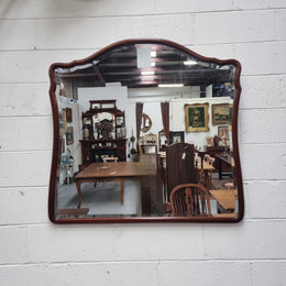 Large Mahogany framed bevelled edge wall mirror. In good original condition.