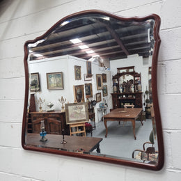 Large Mahogany framed bevelled edge wall mirror. In good original condition.