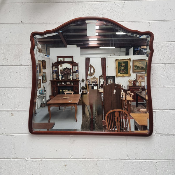 Large Mahogany framed bevelled edge wall mirror. In good original condition.