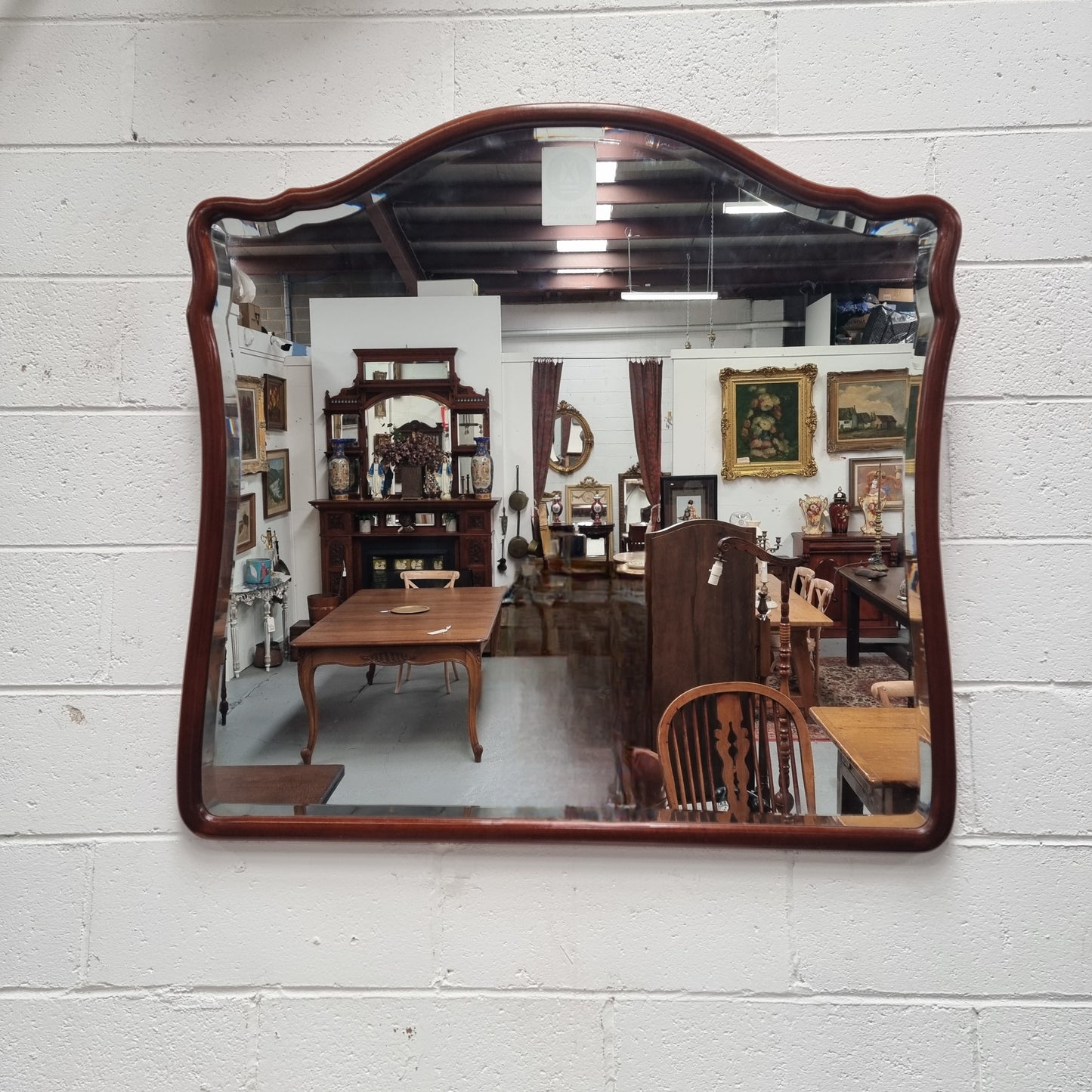 Large Mahogany framed bevelled edge wall mirror. In good original condition.