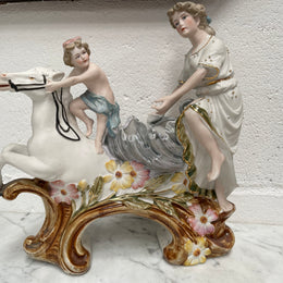 Beautiful Victorian bisque figurine group of a boy and lady riding a white horse. It is in good original condition. Please see photos as they form part of the description.