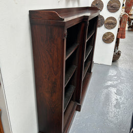 A very functional and highly desirable Rosewood Antique early 19th century free-standing breakfront bookcase. Shelves are adjustable, and trim is in great detailed condition.