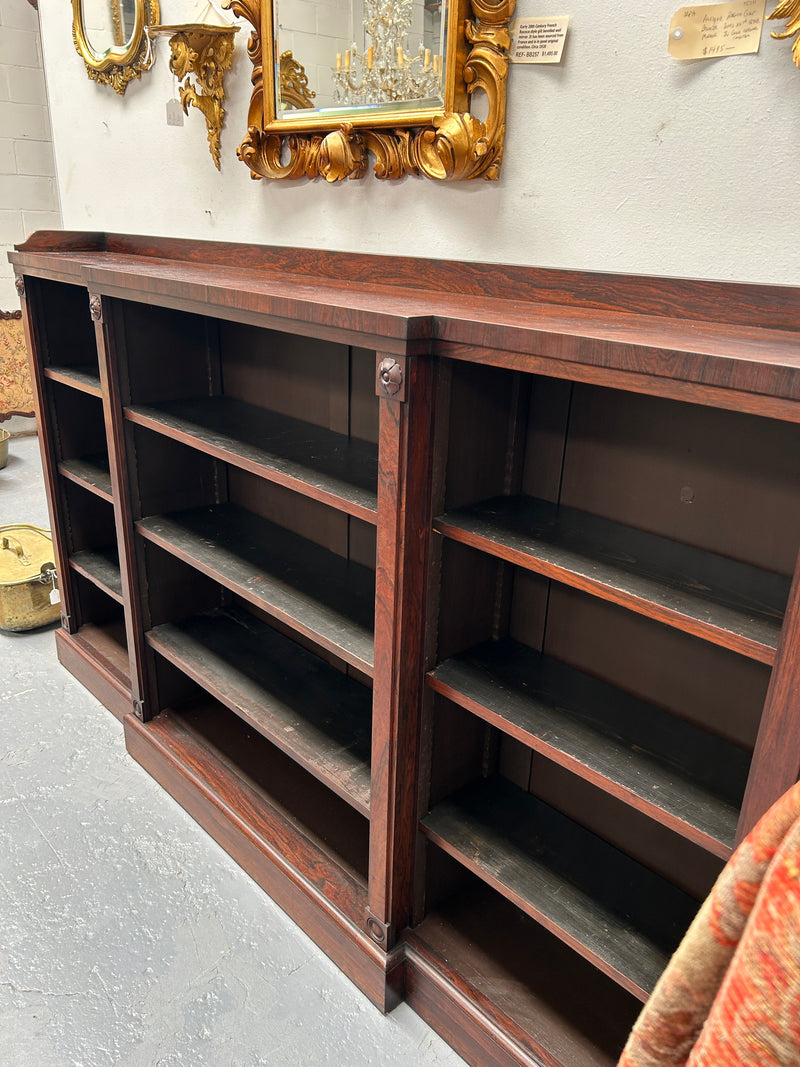 A very functional and highly desirable Rosewood Antique early 19th century free-standing breakfront bookcase. Shelves are adjustable, and trim is in great detailed condition.