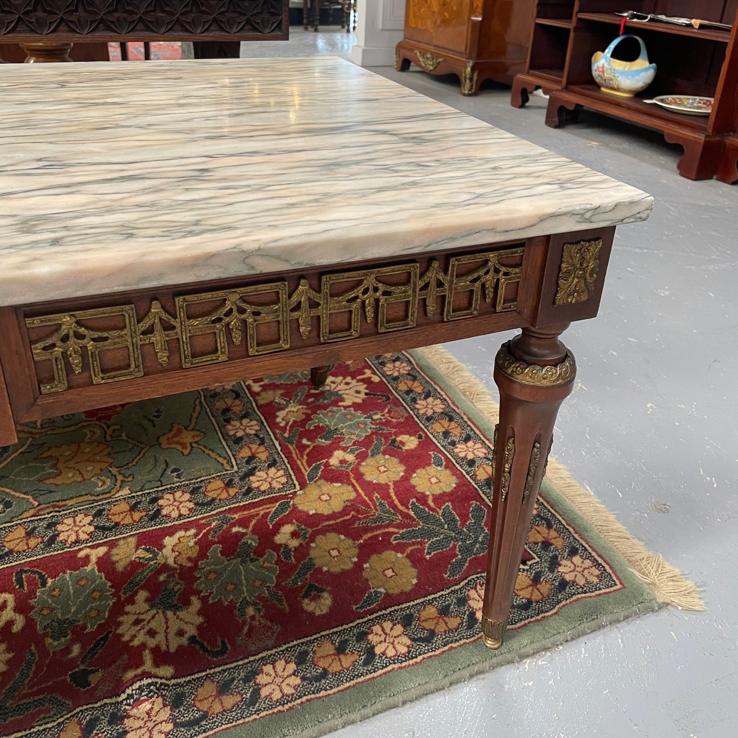 Impressive Louis XVI style walnut coffee table. Stunning marble top, gilt mounts and fluted legs. Circa: 1950's. In good original condition.
