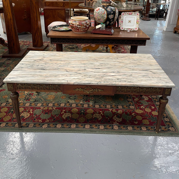 Impressive Louis XVI style walnut coffee table. Stunning marble top, gilt mounts and fluted legs. Circa: 1950's. In good original condition.