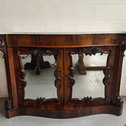 Antique English Rosewood marble top credenza. Featuring two beautiful mirrored doors and a lovely serpentine shaped front. Sourced locally and in good original detailed condition.