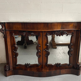 Antique English Rosewood marble top credenza. Featuring two beautiful mirrored doors and a lovely serpentine shaped front. Sourced locally and in good original detailed condition.