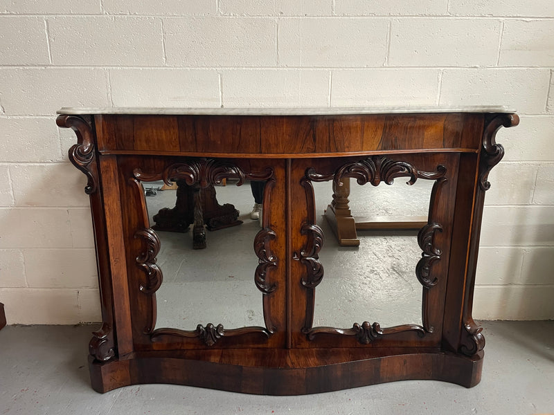 Antique English Rosewood marble top credenza. Featuring two beautiful mirrored doors and a lovely serpentine shaped front. Sourced locally and in good original detailed condition.