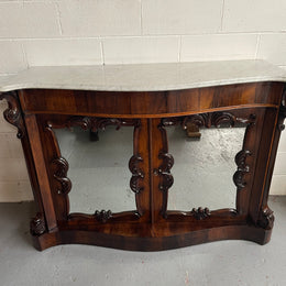 Antique English Rosewood marble top credenza. Featuring two beautiful mirrored doors and a lovely serpentine shaped front. Sourced locally and in good original detailed condition.