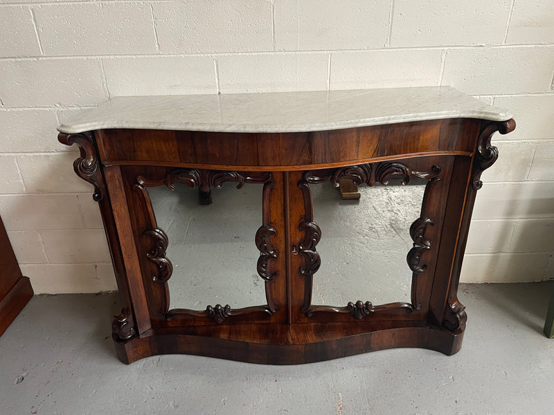 Antique English Rosewood marble top credenza. Featuring two beautiful mirrored doors and a lovely serpentine shaped front. Sourced locally and in good original detailed condition.