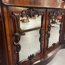 Antique English Rosewood marble top credenza. Featuring two beautiful mirrored doors and a lovely serpentine shaped front. Sourced locally and in good original detailed condition.