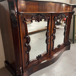 Antique English Rosewood marble top credenza. Featuring two beautiful mirrored doors and a lovely serpentine shaped front. Sourced locally and in good original detailed condition.