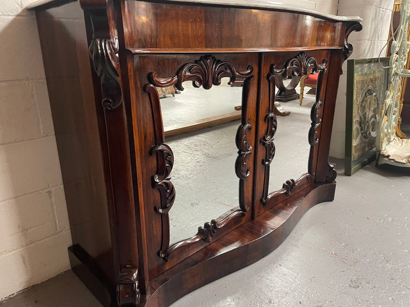 Antique English Rosewood marble top credenza. Featuring two beautiful mirrored doors and a lovely serpentine shaped front. Sourced locally and in good original detailed condition.