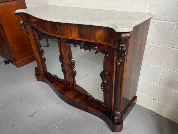 Antique English Rosewood marble top credenza. Featuring two beautiful mirrored doors and a lovely serpentine shaped front. Sourced locally and in good original detailed condition.