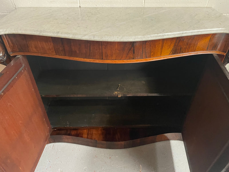 Antique English Rosewood marble top credenza. Featuring two beautiful mirrored doors and a lovely serpentine shaped front. Sourced locally and in good original detailed condition.