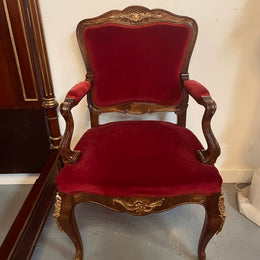 Louis XV style French Walnut armchair/desk chair with red valet upholstery. Fabric is in good condition with some signs of use and features beautiful decorative mounts. It has been sourced from France and is in good original detailed condition. 