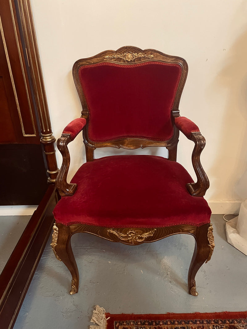 Louis XV style French Walnut armchair/desk chair with red valet upholstery. Fabric is in good condition with some signs of use and features beautiful decorative mounts. It has been sourced from France and is in good original detailed condition. 