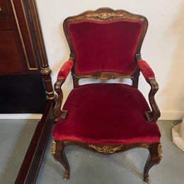 Louis XV style French Walnut armchair/desk chair with red valet upholstery. Fabric is in good condition with some signs of use and features beautiful decorative mounts. It has been sourced from France and is in good original detailed condition. 