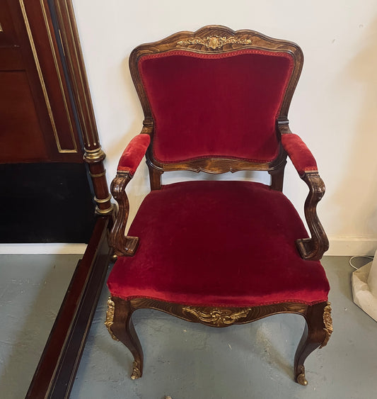 Louis XV style French Walnut armchair/desk chair with red valet upholstery. Fabric is in good condition with some signs of use and features beautiful decorative mounts. It has been sourced from France and is in good original detailed condition. 