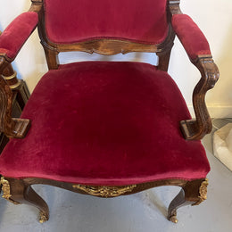 Louis XV style French Walnut armchair/desk chair with red valet upholstery. Fabric is in good condition with some signs of use and features beautiful decorative mounts. It has been sourced from France and is in good original detailed condition. 