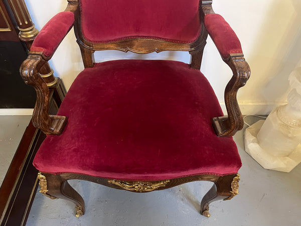 Louis XV style French Walnut armchair/desk chair with red valet upholstery. Fabric is in good condition with some signs of use and features beautiful decorative mounts. It has been sourced from France and is in good original detailed condition. 