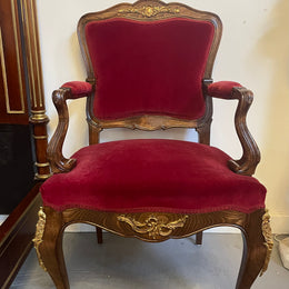 Louis XV style French Walnut armchair/desk chair with red valet upholstery. Fabric is in good condition with some signs of use and features beautiful decorative mounts. It has been sourced from France and is in good original detailed condition. 