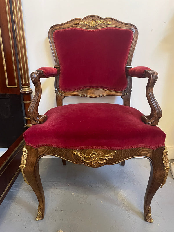 Louis XV style French Walnut armchair/desk chair with red valet upholstery. Fabric is in good condition with some signs of use and features beautiful decorative mounts. It has been sourced from France and is in good original detailed condition. 