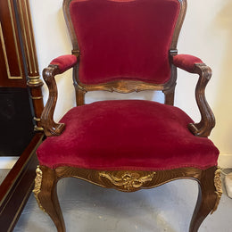 Louis XV style French Walnut armchair/desk chair with red valet upholstery. Fabric is in good condition with some signs of use and features beautiful decorative mounts. It has been sourced from France and is in good original detailed condition. 