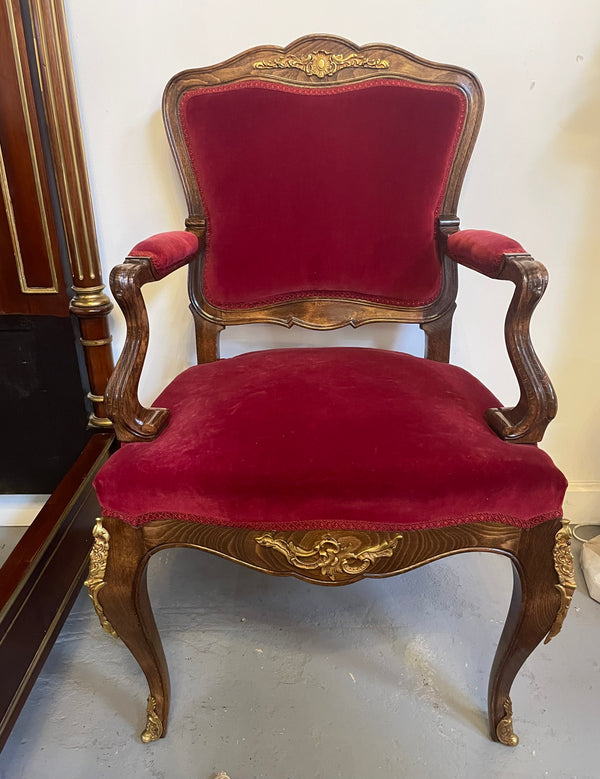 Louis XV style French Walnut armchair/desk chair with red valet upholstery. Fabric is in good condition with some signs of use and features beautiful decorative mounts. It has been sourced from France and is in good original detailed condition. 