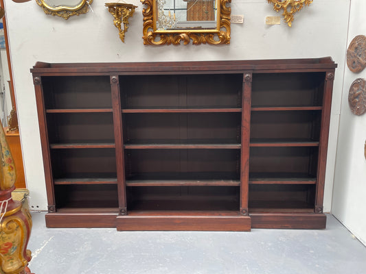 A very functional and highly desirable Rosewood Antique early 19th Century free-standing breakfront bookcase. Shelves are adjustable and trim is in great detailed condition.