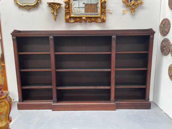 A very functional and highly desirable Rosewood Antique early 19th century free-standing breakfront bookcase. Shelves are adjustable, and trim is in great detailed condition.