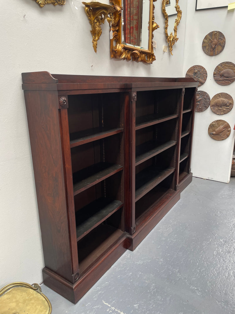 A very functional and highly desirable Rosewood Antique early 19th Century free-standing breakfront bookcase. Shelves are adjustable and trim is in great detailed condition.