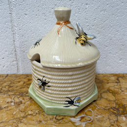 Lovely textured Crown Devon beehive marked Made in England to the base. It has several bees painted. There are some crazing to the base. It is in good original condition.