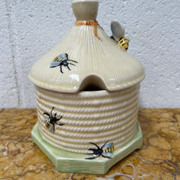 Lovely textured Crown Devon beehive marked Made in England to the base. It has several bees painted. There are some crazing to the base. It is in good original condition.