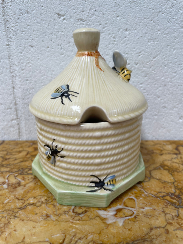 Lovely textured Crown Devon beehive marked Made in England to the base. It has several bees painted. There are some crazing to the base. It is in good original condition.