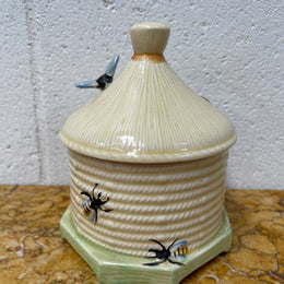 Lovely textured Crown Devon beehive marked Made in England to the base. It has several bees painted. There are some crazing to the base. It is in good original condition.