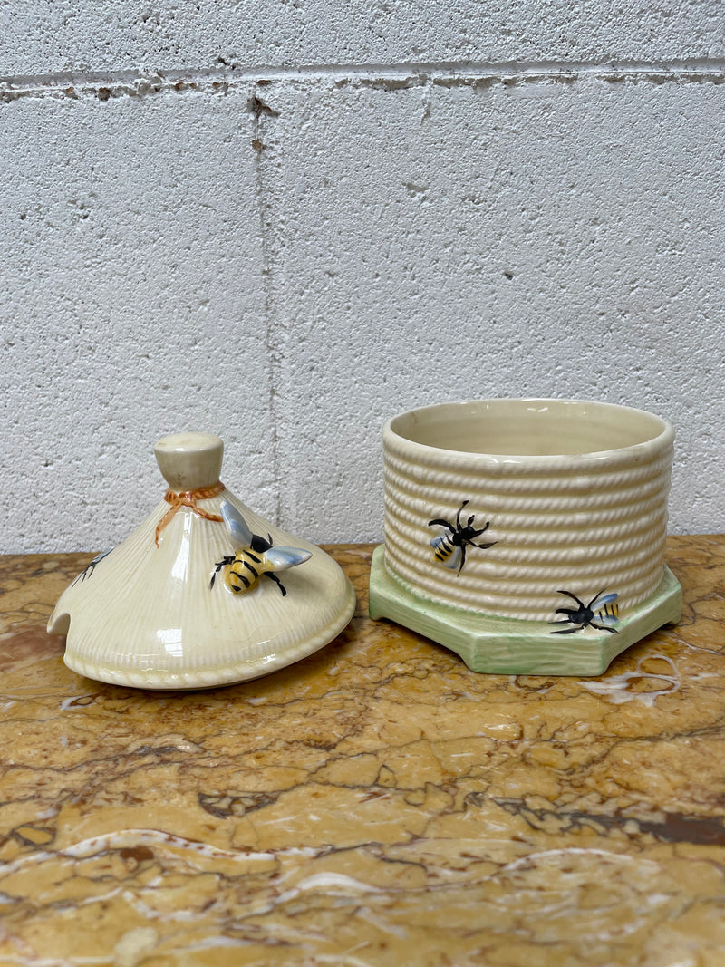 Lovely textured Crown Devon beehive marked Made in England to the base. It has several bees painted. There are some crazing to the base. It is in good original condition.