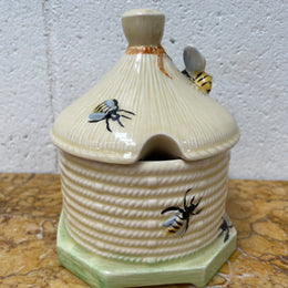 Lovely textured Crown Devon beehive marked Made in England to the base. It has several bees painted. There are some crazing to the base. It is in good original condition.