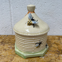 Lovely textured Crown Devon beehive marked Made in England to the base. It has several bees painted. There are some crazing to the base. It is in good original condition.