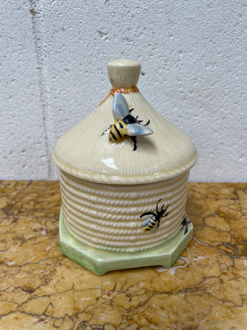 Lovely textured Crown Devon beehive marked Made in England to the base. It has several bees painted. There are some crazing to the base. It is in good original condition.