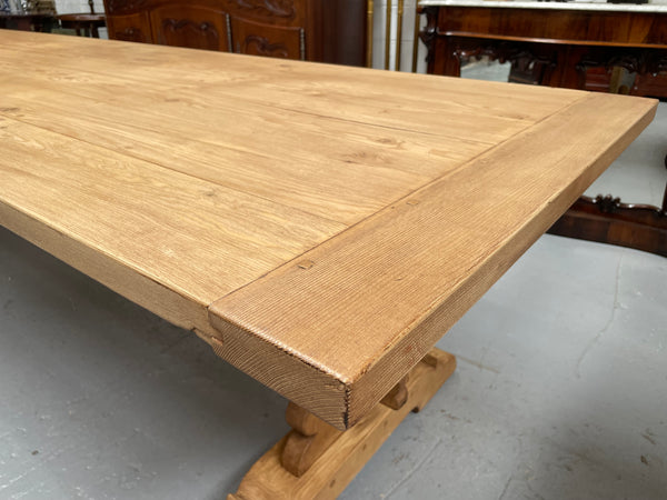 Impressive vintage reclaimed spruce dining table of large proportions. It is in the monastery style with a practical wax finish. Seats 12 persons comfortably and would be great for entertaining. In excellent condition. Please see photos as they form part of the description and condition.