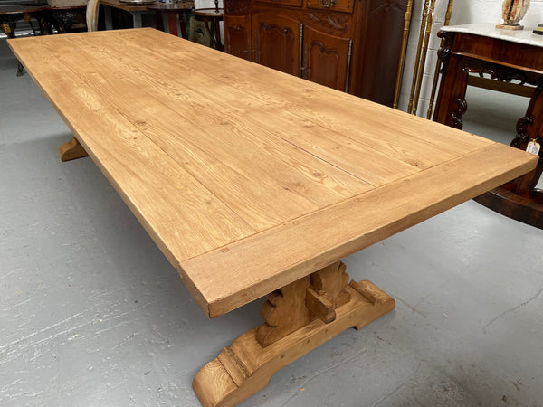 Impressive vintage reclaimed spruce dining table of large proportions. It is in the monastery style with a practical wax finish. Seats 12 persons comfortably and would be great for entertaining. In excellent condition. Please see photos as they form part of the description and condition.