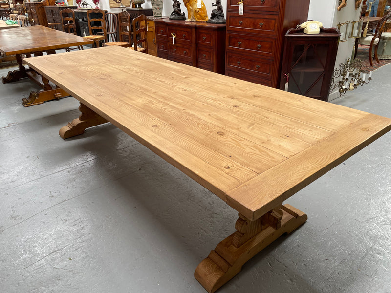 Impressive vintage reclaimed spruce dining table of large proportions. It is in the monastery style with a practical wax finish. Seats 12 persons comfortably and would be great for entertaining. In excellent condition. Please see photos as they form part of the description and condition.