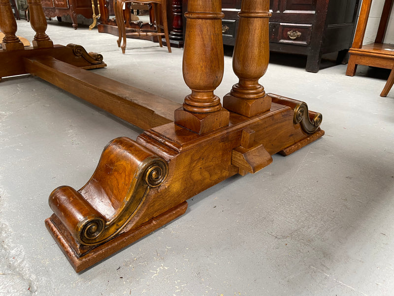 Vintage reclaimed Mahogany parquetry top monastery style dining table. It features beautiful brass mounts on the feet of the table and is in good original detailed condition. It can comfortably seat eight people. 