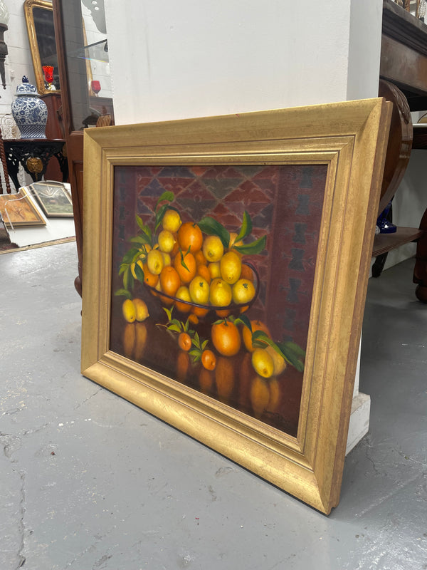 Beautiful original oil on board painting of lemons and oranges. It is framed in a lovely simple gold frame and ready to hang. Signed by artist. Please see all photos as they form part of the description and condition.