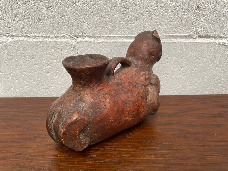 Pre-Columbia terracotta ceramic vessel. Most likely depicting a cat in good condition for its age. 