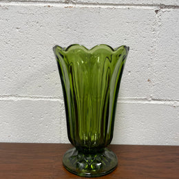 Lovely vintage green glass vase with a pretty scalloped edge and good height for flowers.