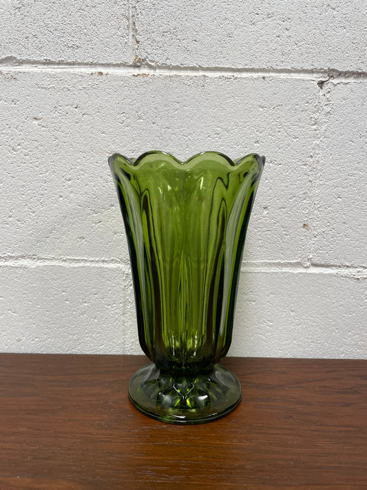 Lovely vintage green glass vase with a pretty scalloped edge and good height for flowers.